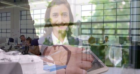 Double Exposure of Businessman Using Tablet and Smiling Businesswoman