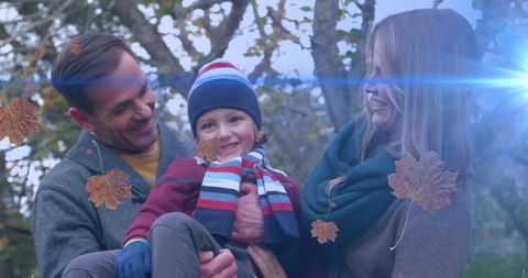 Happy Family Enjoying Autumn Outdoors with Falling Leaves Effect - Download Free Stock Images Pikwizard.com