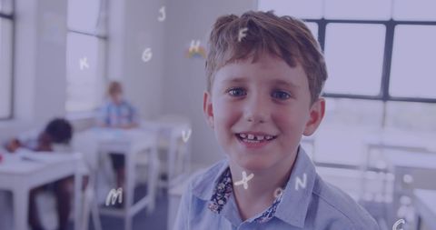 Smiling Schoolboy Enjoying Learning in Classroom - Download Free Stock Images Pikwizard.com