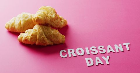 Croissants Celebrating Croissant Day on Pink Background
