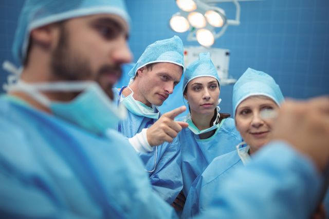 Team of surgeons having discussion in operation theater - Download Free Stock Photos Pikwizard.com