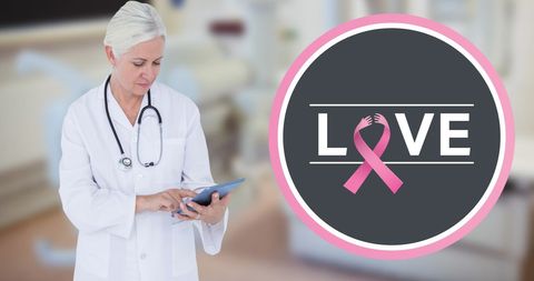 Breast cancer awareness with doctor using tablet technology