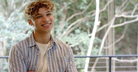 Man enjoying tranquil forest view with natural light