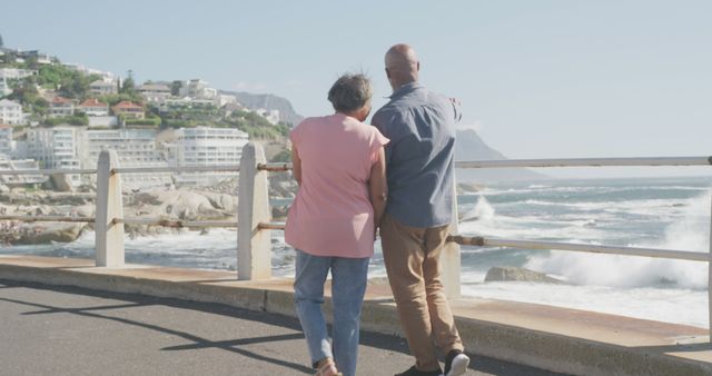 Senior Couple Walking on Boardwalk Near the Ocean - Download Free Stock Images Pikwizard.com