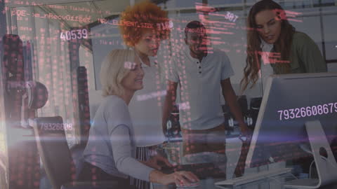 Diverse Team Analyzing Data on Computer Screens in Modern Office
