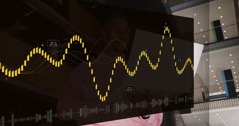 Professional viewing interactive analytics waveform dashboard in modern atrium