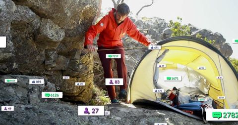 Explorer adjusts tent guy lines on rocky terrain with social media overlay