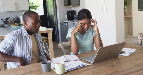Frustrated Couple Budgeting Finances at Home with Laptop and Documents - Download Free Stock Images Pikwizard.com