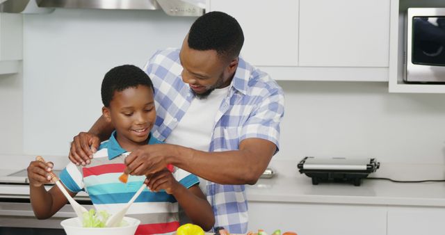 Father and Son Cooking Dinner Together in Modern Kitchen - Download Free Stock Images Pikwizard.com