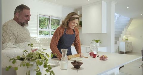 Couple Enjoys Home Baking Day in Modern Kitchen
