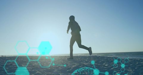 Data Overlay on African American Man Running on Beach - Download Free Stock Images Pikwizard.com