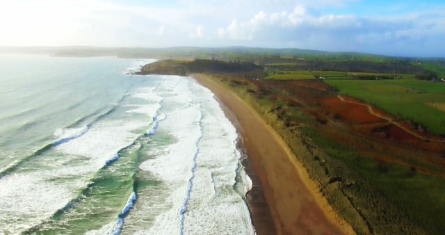 Aerial View of Scenic Clifftop Beach with Rolling Waves - Download Free Stock Images Pikwizard.com