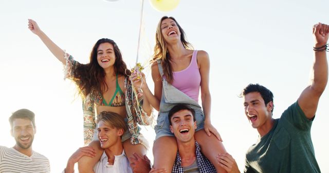 Group of Friends Celebrating at Beach with Balloons - Download Free Stock Images Pikwizard.com