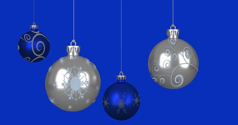 Festive Silver and Blue Christmas Ornaments on Bright Blue Background - Download Free Stock Images Pikwizard.com