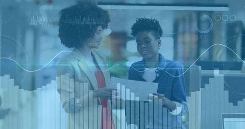 Two Women Discussing Business Strategy with Digital Data Overlay