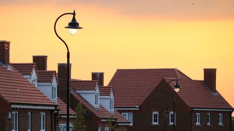 Suburban Neighborhood at Dusk with Orange Sky