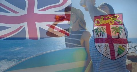 Surfers enjoy ocean view with beers and surfboards under fiji flag