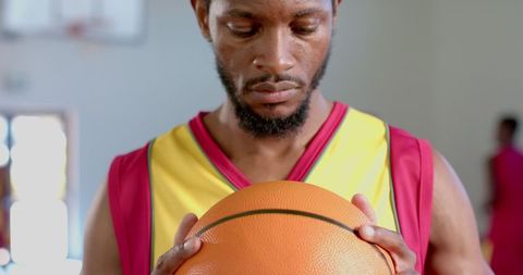 Determined basketball player focused on preparation in gym