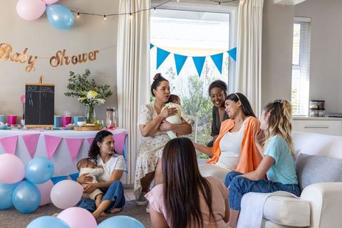 Diverse Group Celebrating Baby Shower with Friendship and Joy