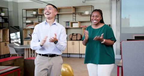 Diverse colleagues celebrating office opening ceremony