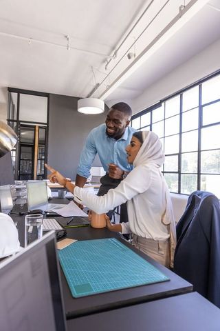 Diverse Coworkers Collaborating in Bright Modern Office