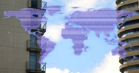 Glitching holographic world map spanning urban skyline between high-rise towers