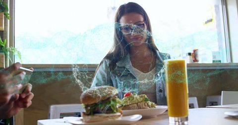 Young Woman Enjoying Breakfast at Trendy Cafe