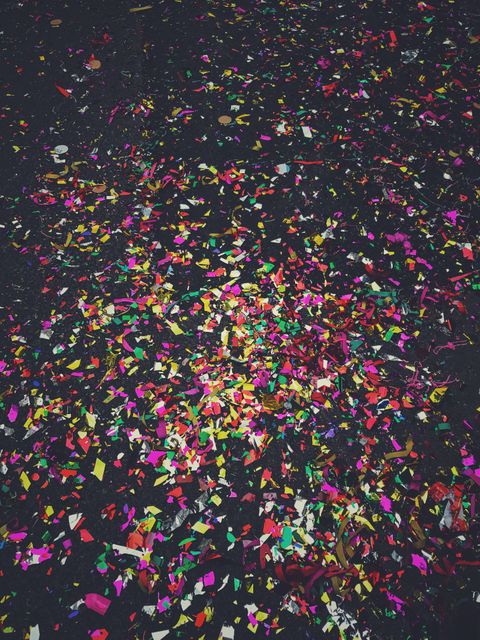 Colorful Confetti Spread on Dark Surface After Celebration - Download Free Stock Photos Pikwizard.com