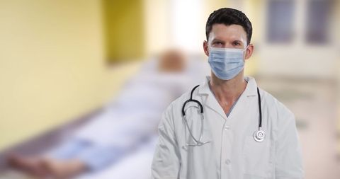 Caucasian Doctor Wearing Mask in Hospital Setting