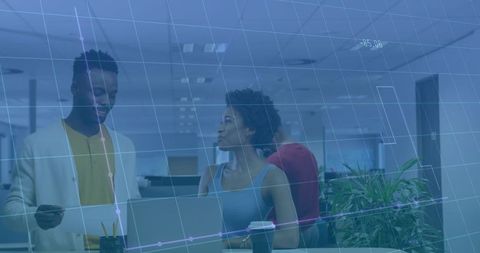 Diverse Team Analyzing Data at Corporate Office Desk