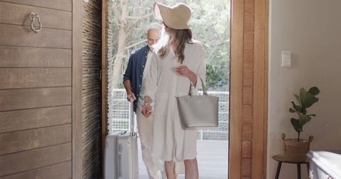 Couple arriving at hotel room for relaxing nature getaway