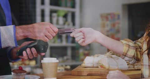 Contactless Payment in Cafe with Debit Card and Coffee