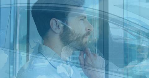 Businessman Thinking Inside Car with World Map Overlay
