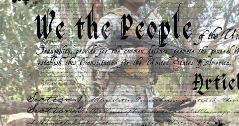 Soldier Standing in Woodland Holding Rifle with 'We the People' Constitution Overlay