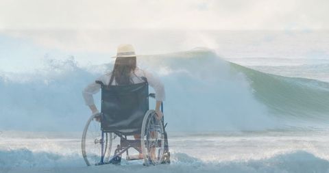 Inspiring Ocean View with Woman in Wheelchair Embracing Waves