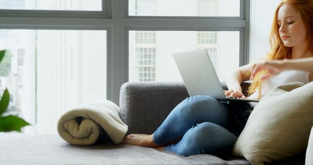 Young Woman Working Remotely with Laptop in Modern Home - Download Free Stock Images Pikwizard.com