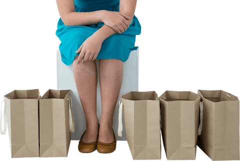 Caucasian woman sitting with shopping bags transparent background