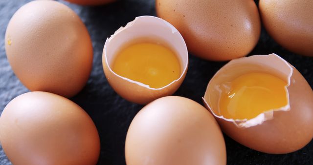 Close-Up of Fresh Brown Eggs with Broken Shells and Yolks - Download Free Stock Images Pikwizard.com