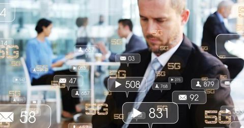 Businessman checking phone and tablet in corporate lounge with 5g data and social overlays