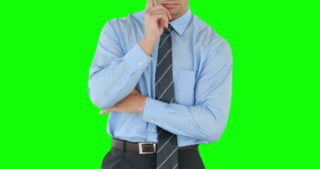 Businessman Thinking While on Phone Call in Front of Green Screen - Download Free Stock Images Pikwizard.com