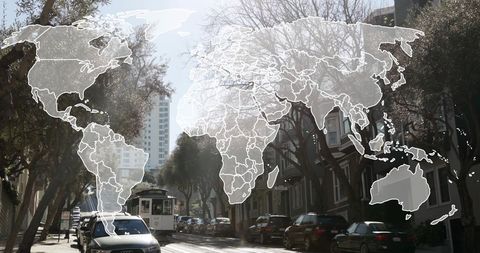 Digital World Map Overlay on Bustling Urban Street