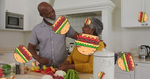 Senior couple preparing a meal with playful hamburger graphics