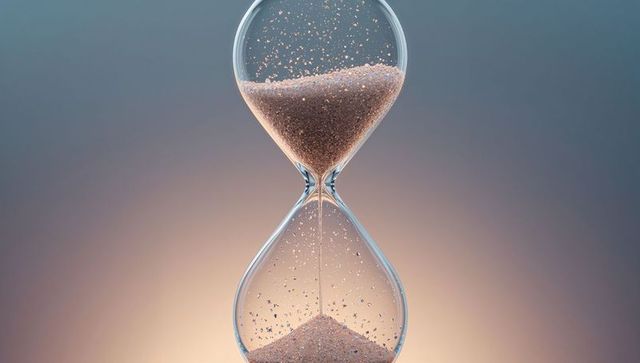 Elegant hourglass with flowing sand symbolizing time's passage