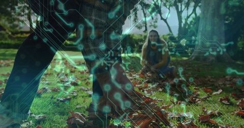 Couple collecting autumn leaves with circuit overlay effect