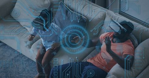 Father and Son Engaging in Virtual Reality Experience with Futuristic Technology