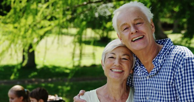 Happy Senior Couple Smiling in Sunlit Park - Download Free Stock Images Pikwizard.com