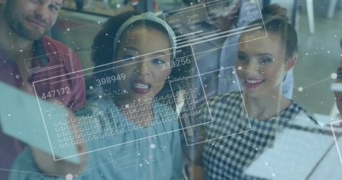 Team collaborating around glass display with holographic augmented reality data interface