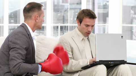 Business Competition Idea Symbolized by Colleagues and Boxing Gloves