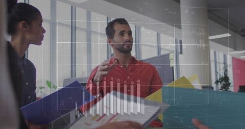 Man Presenting Financial Charts in Modern Office Setting