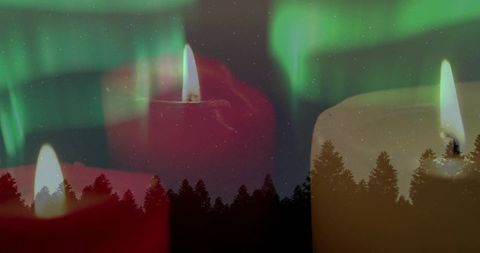 Trio glowing pillar candles blending with aurora borealis over pine treeline silhouette